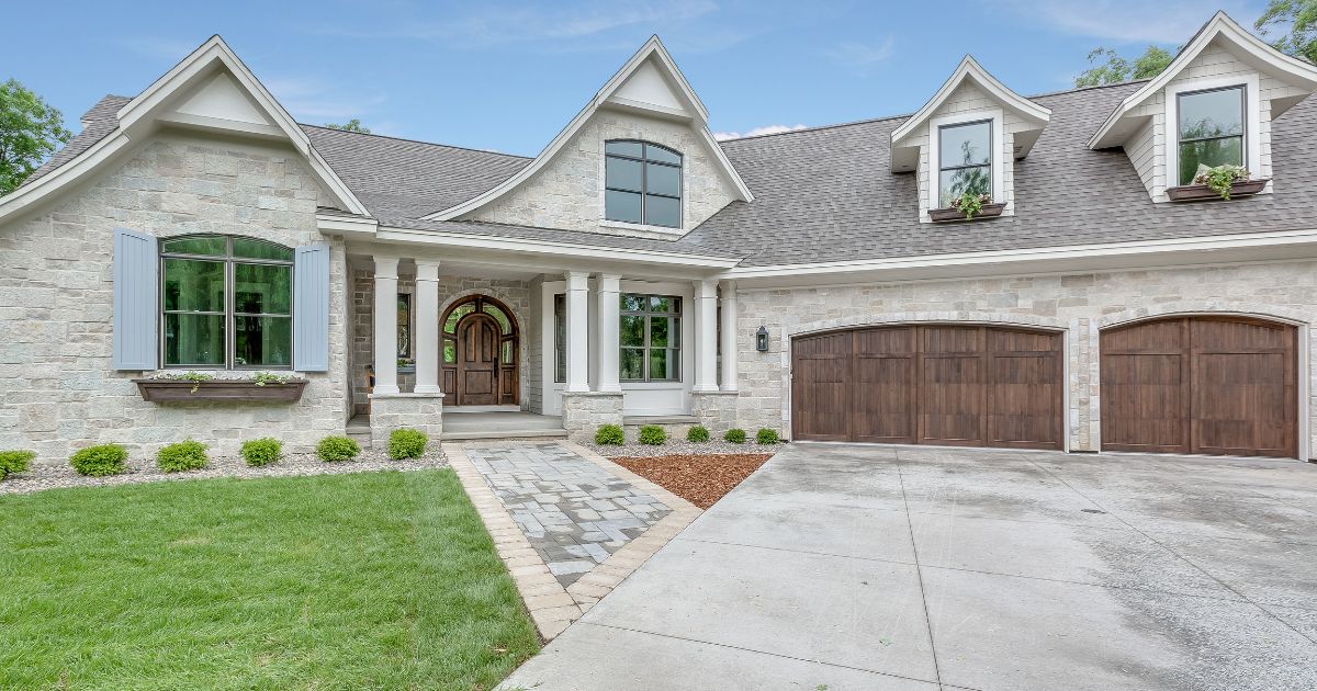 Exterior of a single-family home with a two-car garage, representing VA loan refinance options including IRRRL and cash-out refinance for San Diego homeowners