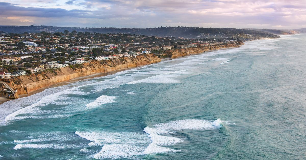 Aerial view of homes along the coastal bluffs above the Pacific Ocean in San Diego County